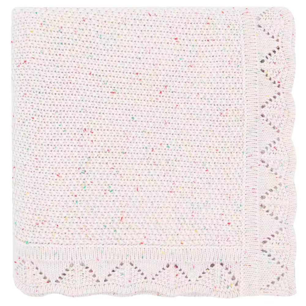 White knitted blanket with multicolored speckles on a white background